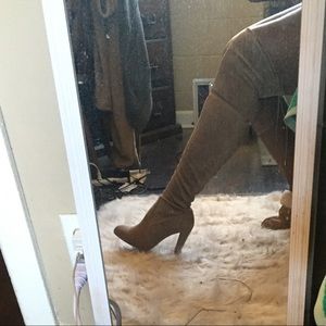 Tan over the knee boots.